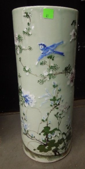 Chinese Celadon Umbrella Stand: Chinese celadon umbrella stand, with raised work pat sur pat floral blossoms, cylindrical form, late 19th C. 24 1/8" h. CONDITION: Small areas of manufactures glaze imperfections.