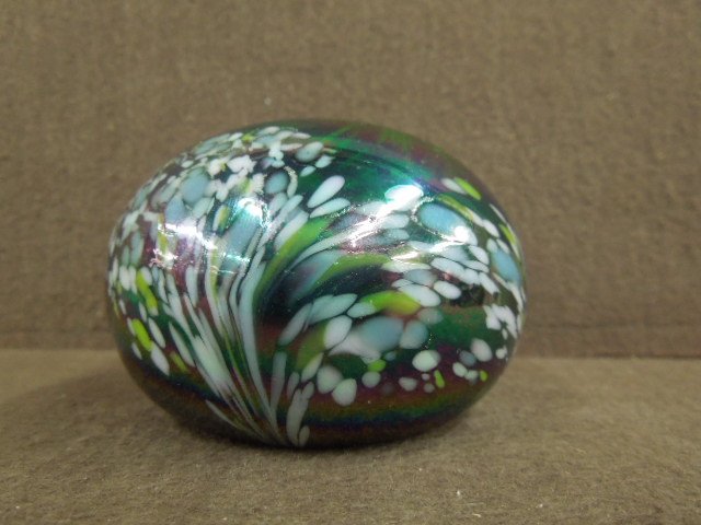 Mt St. Helens Ash, Glass Paperweight: Mt. St. Helens Ash, glass paperweight, white with dark iridescent, 3 1/4" diameter x 2 1/4"H ( slightly flat top), signed on bottom. CONDITION: Minor wear from age.