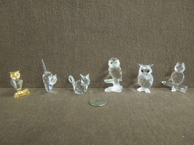 6 Swarovski Crystal Figures: (6) Swarovski crystal figures including; Night Owl #206138, 2 1/8"h, Owl on Branch, 2 5/8"h, Set of 2 - Owl on Branch, 2" Owl with gold overlay (Branch & head), 1 3/4"h, plus (2) Cats, #198241, 2" and