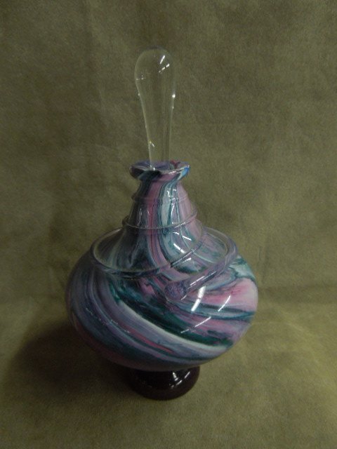 Unmarked Swirl Glass Perfume Bottle: Unmarked crystal perfume bottle, pink, white, green and blue swirl design, amethyst base, with clear crystal ground end stopper, applied glass thread form accent around top of bottle, 3 3/4" diameter