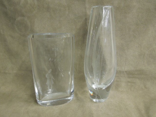 2 Orrefors Etched Crystal Vases: 2 Orrefors etched crystal vases, (1) etched child red around the may pole with violinist on the reverse, 2 7/8" x 4 1/4" x 7"h and (1) Geometric line design from and back, 2 3/4" x 3 1/4" x 9 1/4". CO