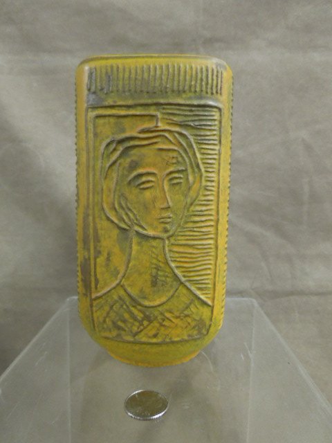 Italian Pottery Vase: Italian pottery vase; signed on base "Raymor", relief carved ribbed body with female cameo portrait, mustard glaze, mid 20th c. H 7 1/2". CONDITION: No issues noted.