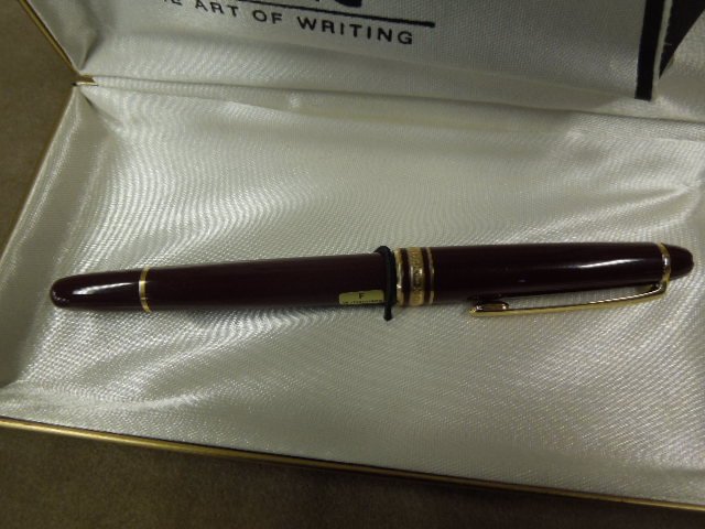 Mont Blanc Fountain Pen: Mont blanc fountain pen, in original box with guarantee maroon w/gold (tone?) bands, center band - Mont blanc Meister stuck, top marked 4810, 14k Mont Inc. white star at end of cap, W. Germany. CONDIT