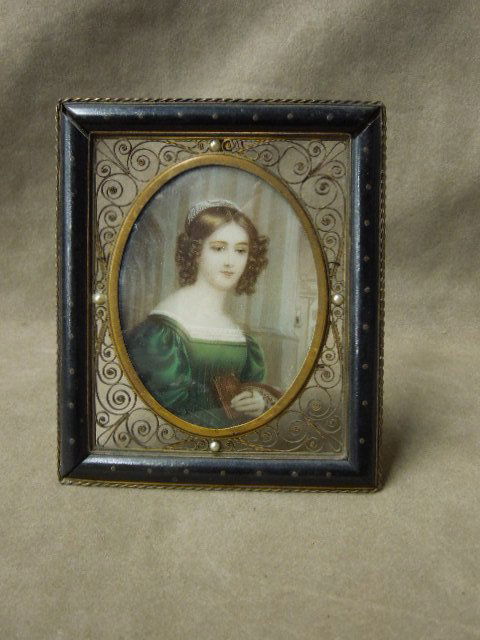 Framed Hand Painted Portrait of Woman: Framed hand painted (Stieler) artist signed portrait of woman, ebony with open wire work frame (4" x 4 3/4") inset with four small pearls, 19th / 20th C. CONDITION: Some wear from age, glass & picture