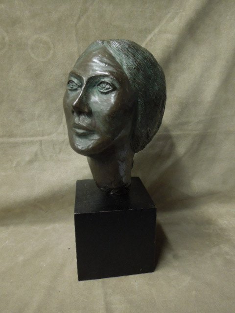 Contemporary Bronze Sculpture: Contemporary bronze portrait buts: Image of a Woman with head tiltled up, signed with initials "RP", and dated [19]90. Mounted on an ebonized wood block base 10"=h [sculpture] 15"=H [w/base]. CONDITIO