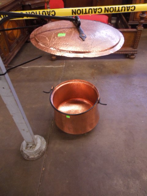 Copper Covered Cauldron: Copper covered cauldron, hand hammered with chaised lid & iron handles & wall bracket, 20th C. 18 1/2" d 18" h CONDITION: No issues identified.