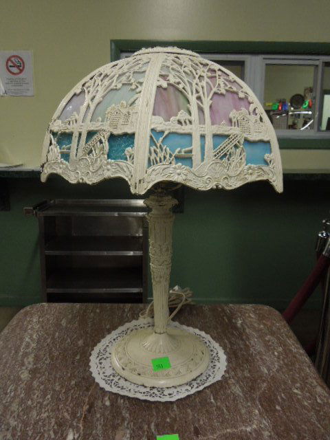 Slag Glass Table Lamp Miller Lamp Co: Miller Lamp Co. slag glass table lamp, white painted metal base & reticulated lake / cottage scene shade with blue & amethyst glass panels, early 20th C. base, signed "M.L. Co." 22" = h 16 1/2" = d CO