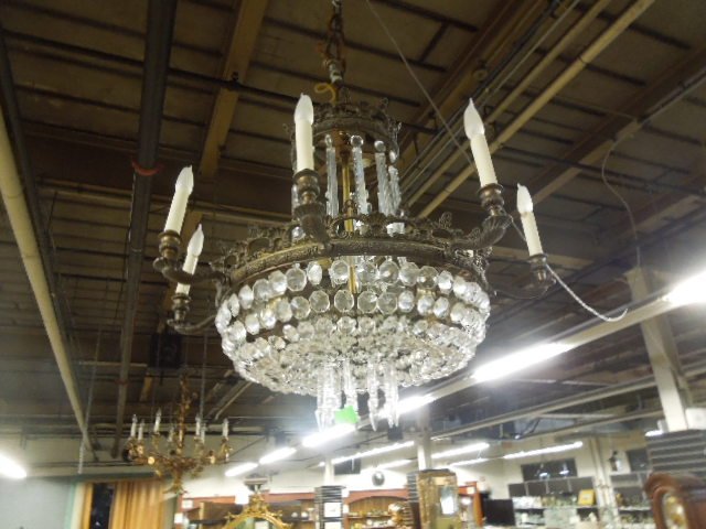 Baroque Style Chandelier: Baroque style chandelier, brass & crystal; shell & scroll carved frame w/eight lights; cut crystal spears & domed beads, early 20th c., 22" h, 22" d. CONDITION: One spear broken & repaired, some spear