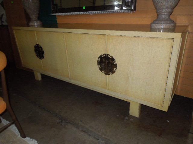 Mid Century Oriental Style Credenza: Mid century Oriental style credenza, limed mahogany finish with large brass escutcheons, dark mahogany interior of drawers & shelves. 90" x 34" x 19". CONDITION: Normal wear.