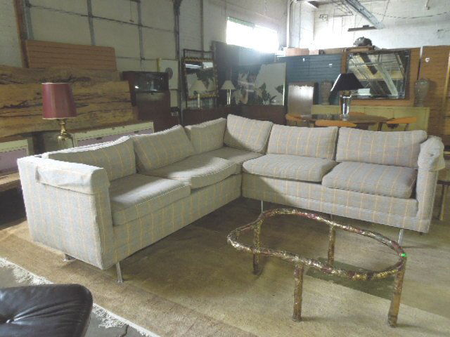 Modern Style Sectional Sofa: Modern style sectional sofa, in two sections, beige, gray & white plaid cloth upholstery, high cylindrical brushed metal legs, late 20th C. CONDITION: No issues identified.