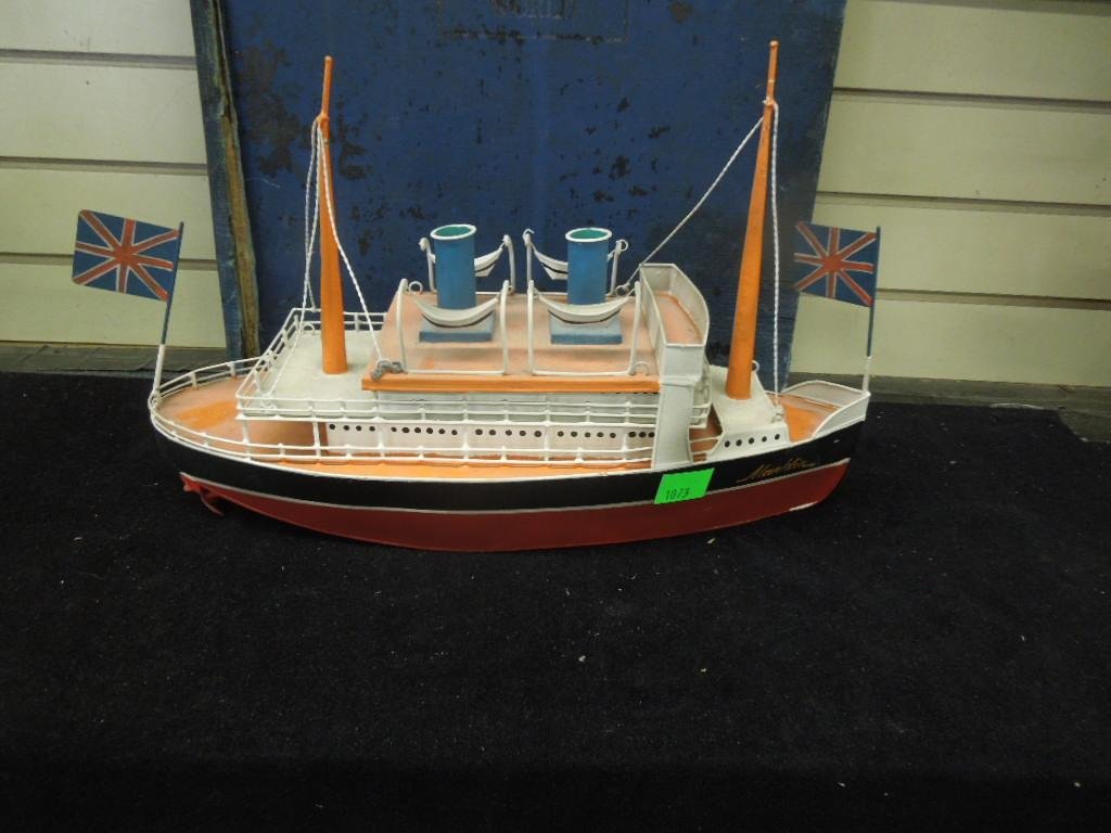 Tin Queen Elizabeth Boat: Tin Queen Elizabeth Boat, hand painted by Marklin with British flags front and back. 17" x 11" Condition: Some wear and paint loss especially on bottom.