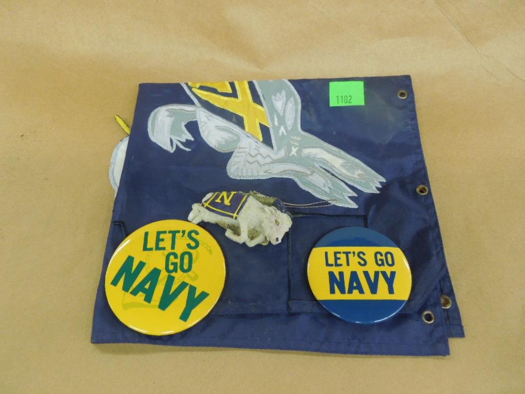 2 Naval Academy Buttons & Banner: 2 Naval academy buttons "Lets Go Navy" 3" diam. plus 18" x 20" folding banner with ram on one side, go navy on other Condition: Minor wear