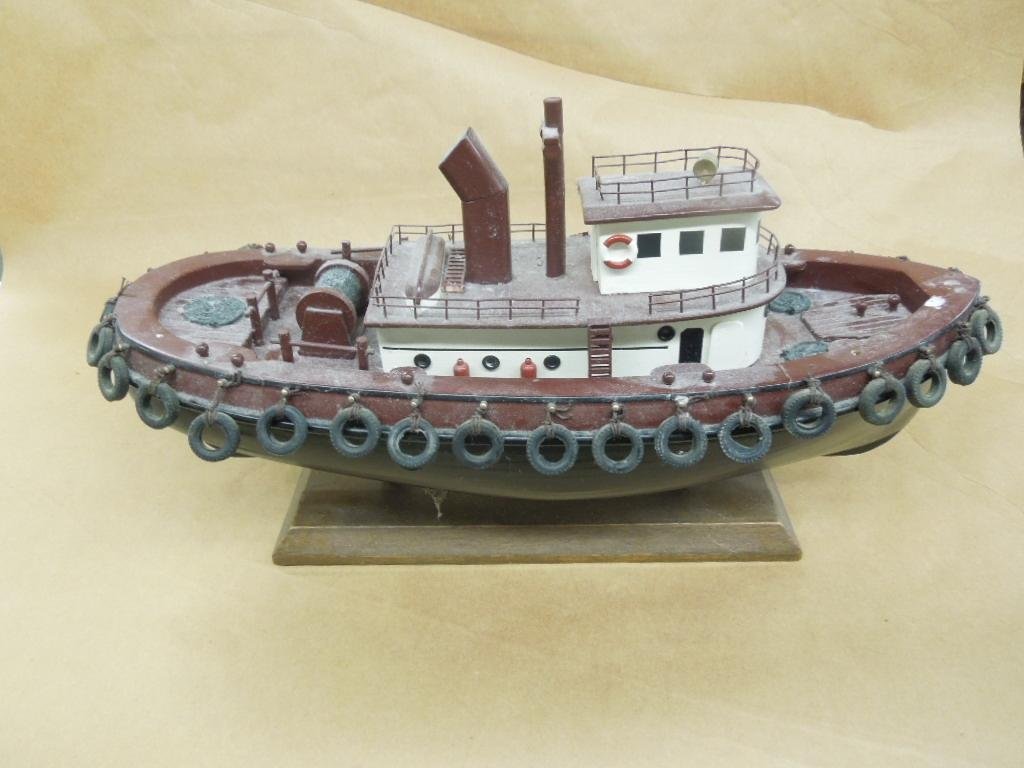 Carved Wood Tug Boat Model: Carved Wood Tug Boat Model, hand painted, mounted on stand, moveable propeller, nice detail, 17 1/2" x 9 1/2" including stand Condition: Very minor paint loss