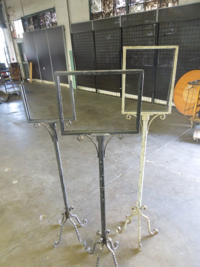 3 wrought iron display stands: 3 wrought iron display stands, may have been used as menu displays on cruise ships or message display at train stations, (1) 52 1/2", (1) 65" and (1) 61"Condition; some wear, bases are slightly loose