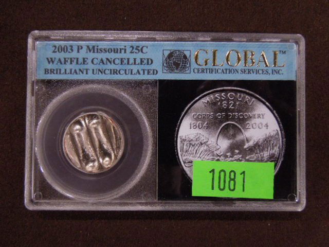 2003 P Missouri 25 cents Waffle Coin: 2003 P Missouri 25 cents waffle coin cancelled, brilliant uncirculated, by Global Certification Services Inc. in protective plastic case. CONDITION: Brilliant uncirculated.