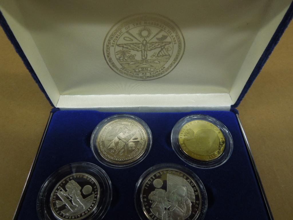 Set of 4 Man On The Moon Proof Coins: Set of four Man On The Moon Proof Coins, Republic of Marshall Islands including: $50 coin (.999 silver), $20 coin (.999 silver), $10 coin (solid brass), & $5 coin cu pro- nickel, all in hard plastic c