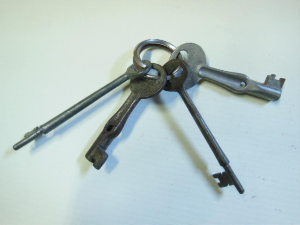 4 RR Switchback & Door Keys: Four railroad switchback & door keys including; two switch lock keys, NYCS & NYCRR & two door keys, NYC (Adlake & J.LM & Co.), plus one screw lock key.