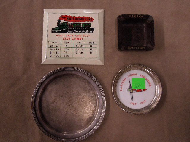 Vintage Railroad Table Memorabilia: Four vintage railroad table, etc. memorabilia, to include: Union Pacific Railroad silverplate tip tray & plastic ashtray; Eastern signal engineers coaster; "the Railroad Line" shoe & sock size chat, e
