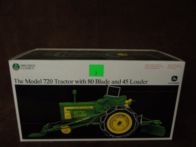 John Deere Die Cast Tractor: Precision Classics John Deere model 720 die-cast tractor with 80 Blade & 45 loader. CONDITION: New.