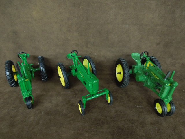 3 John Deere Die Cast Tractors by Ertl: Three John Deere die-cast tractors by Ertl. Includes: Model "G", Expo-1x, "BN". CONDITION: Good, used, no boxes.
