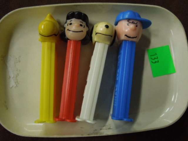 4 Peanuts Pez Dispensers: Four Peanuts Pez dispensers, including: Charlie Brown, Lucy, Snoopy & Woodstock, loose. CONDITION: Very minor wear.
