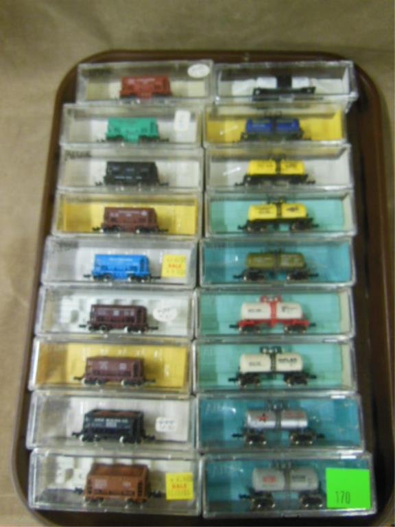 "N" Gauge Tank/coal Cars: Eighteen Atlas "N" gauge old store stock tank & coal cars; original plastic boxes. CONDITION: Minor wear from age.