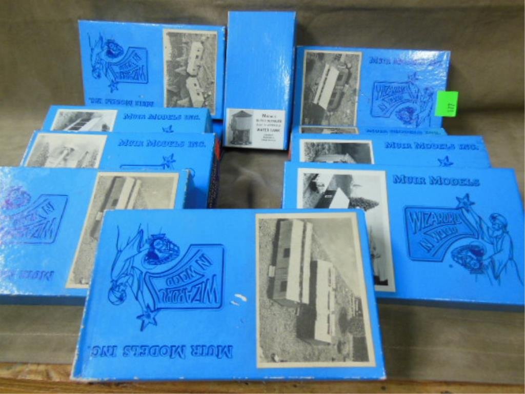 11 Muir Wood Train Models: Eleven Muir wood train models, old store stock, wizards in wood, featuring assorted houses & buildings, all in original boxes. CONDITION: Good OSS.