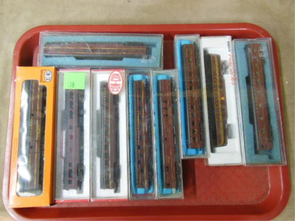 9 Con Cor "N" Gauge Trains: Nine Con cor "N" gauge trains, featuring: one Arnold Rapido engine & eight passenger cars, old store stock in original boxes. CONDITION: Good, OSS.