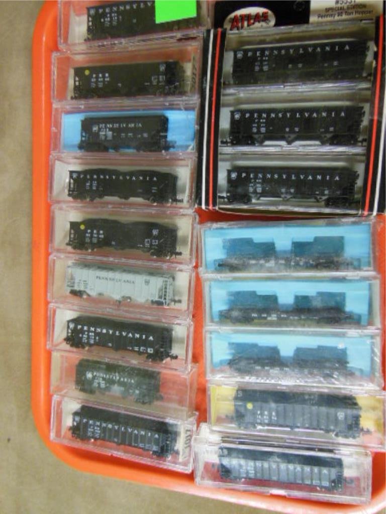 17 P.R.R. Box & Other Cars: Seventeen P.R.R. box & other cars, featuring: one box car, three flat cars & thirteen freight cars, all old store stock in original boxes. CONDITION: Good, OSS.
