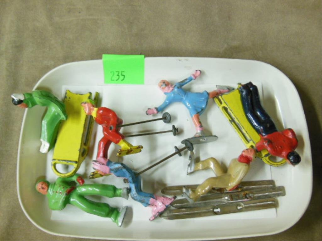 7 Lead Winter Sports Figures: Seven lead winter sports figures, skiers, skaters, & sleders, approximately 2 3/4" each. CONDITION: Paint loss, two sleders missing feet,missing one ski.
