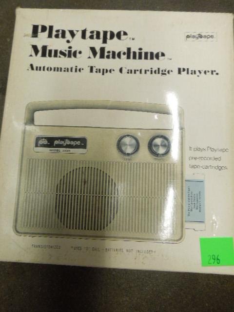 Play Tape Music Machine: Play tape music machine like new in original box, model 1320 with cartridge still in package "Ray Barretto - Viva Watusi", instruction book & warranty card, color-ivory. CONDITION: Good in box.