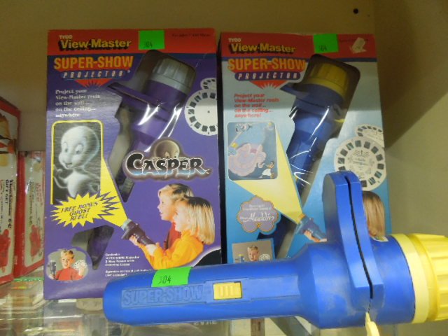 (3) View Master Super Show Projectors: Three View Master Super show projectors including; two in original packages, Casper & Aladdin, plus one loose projector. CONDITION: Boxes have some wear & bends.