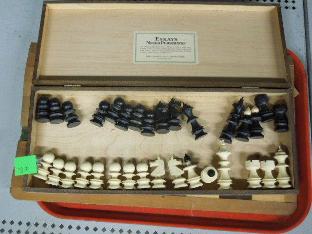 Ebonized & Natural Ivory Chess Set: Ebonized and natural ivory chess set, along with roll up wood board, early 20th c. pawn hgt 1 1/2", king hgt 3". CONDITION: Board with wood sections missing.