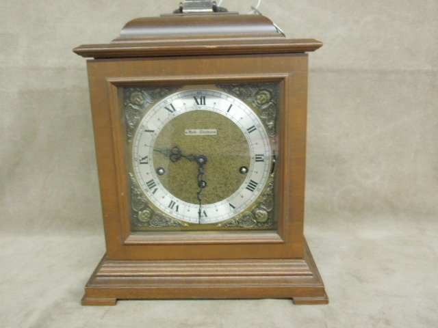 Seth Thomas Wood Case Shelf Clock: Seth Thomas wood case shelf clock, three chime A 403-002 movement, made in Germany for Seth Thomas, two (2) jewels 7706, time, strike & chime, brass handle at top, pad feet 7 1/4" x 10 3/4" h, with ke