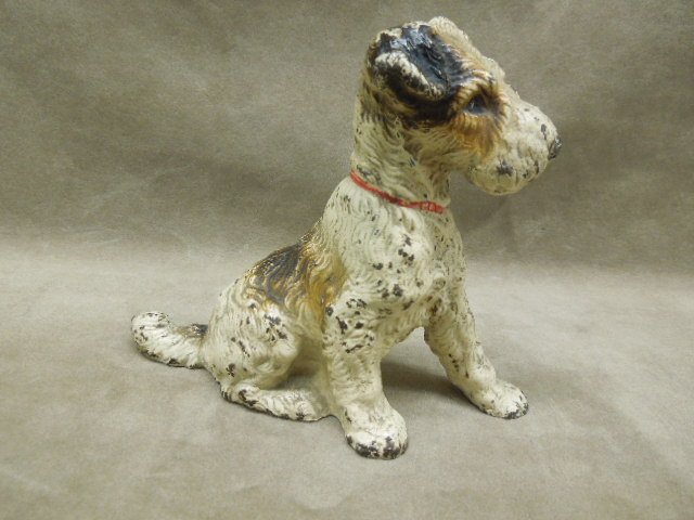 Vintage Cast Iron Doorstop: Vintage cast iron doorstop, Terrier, hand painted, no marking 6"w x 4 1/2"h. CONDITION: Some paint loss throughout.
