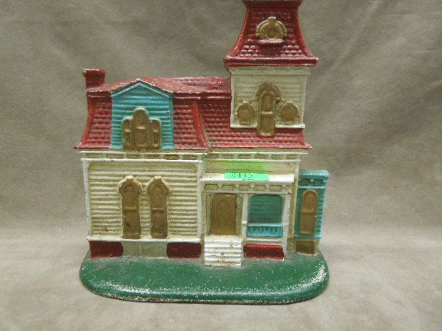 Victorian House Cast Iron Doorstop: Hand painted cast iron doorstop, Victorian home, unsigned, 7 1/4"w x 7 1/2"h. CONDITION: Some paint loss especially at base.