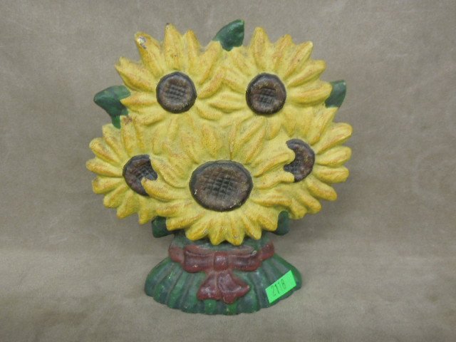 Vintage Sunflower Cast Iron Doorstop: Vintage Sunflower cast iron doorstop, hand painted unsigned, 7 1/2"w x 8"H. CONDITION: Some paint loss mainly at back.