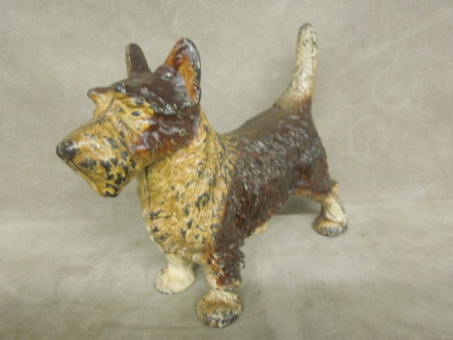 Vintage Painted Cast Iron Scotty Doorstop: Vintage painted cast iron Scotty doorstop browns, unmarked, 11"L x 8"H. CONDITION: Paint loss, especially on feet, face and tail.