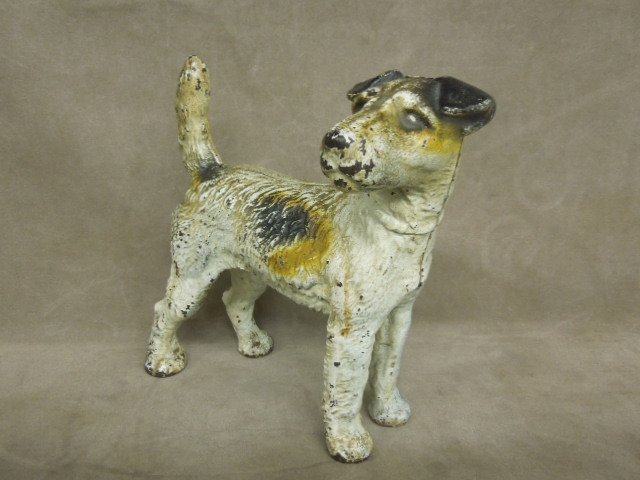 Vintage Cast Iron Dog Doorstop: Vintage cast iron dog doorstop, Fox Terrier, hand painted, no markings, 9"L x 8"h. CONDITION: Some paint loss, especially on legs, face and tail.