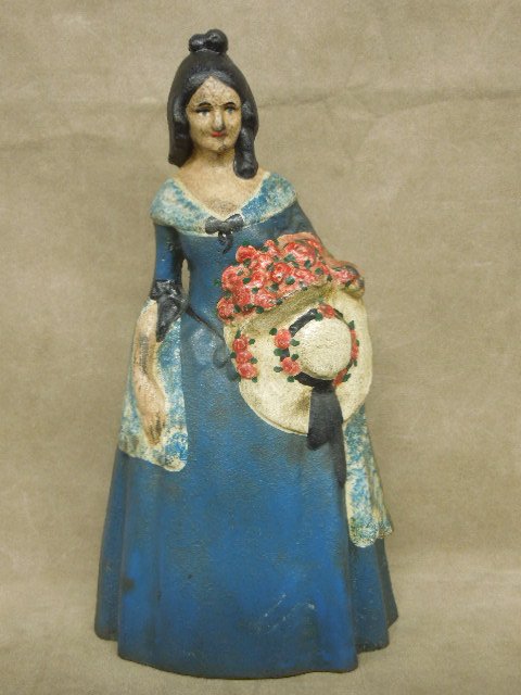 National Foundry Southern Belle Doorstop: National Foundry painted cast iron Southern Belle doorstop, hollow back, #6 inside back 11 1/4" x 6". CONDITION: Some wear and loss to paint.