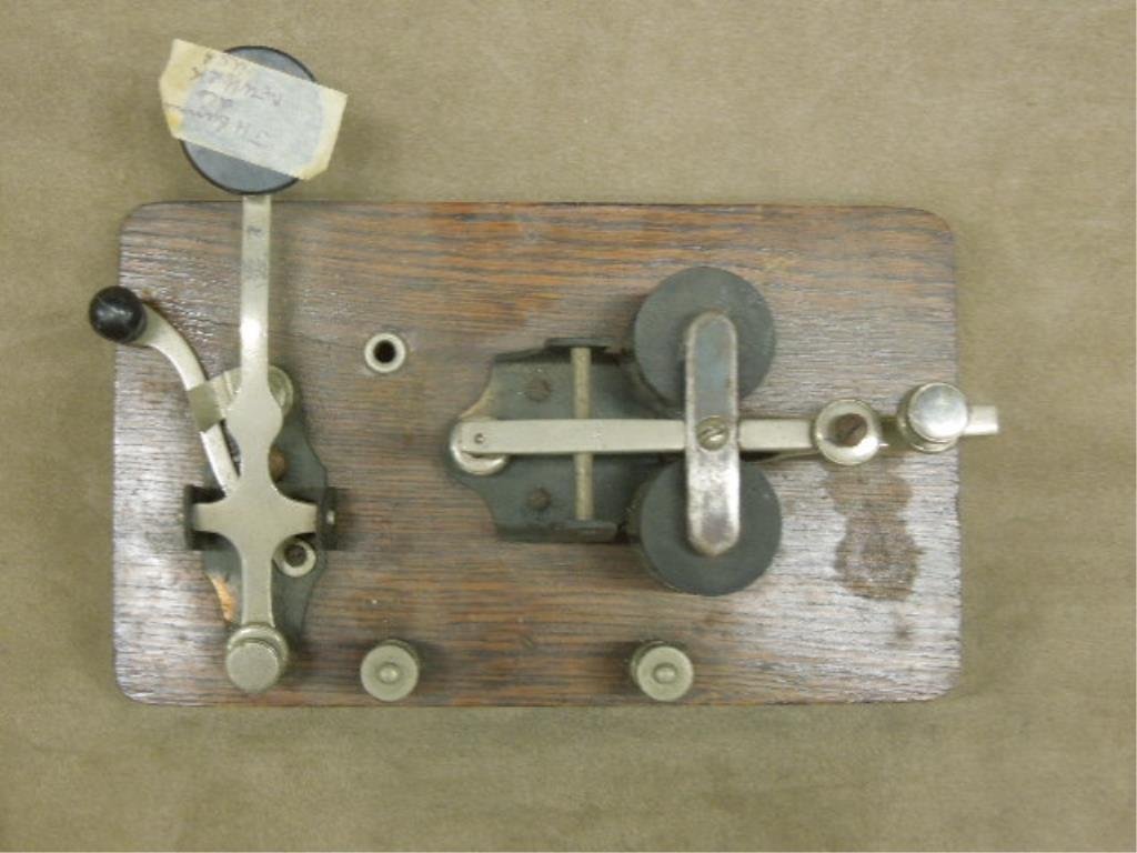 Vintage J. H. Bunnel Morse Code Telegraph Key: Vintage J. H. Bunnel & Co. New York Morse code telegraph key with oak base, circa early 1900s. CONDITION: Good, showing wear from age.