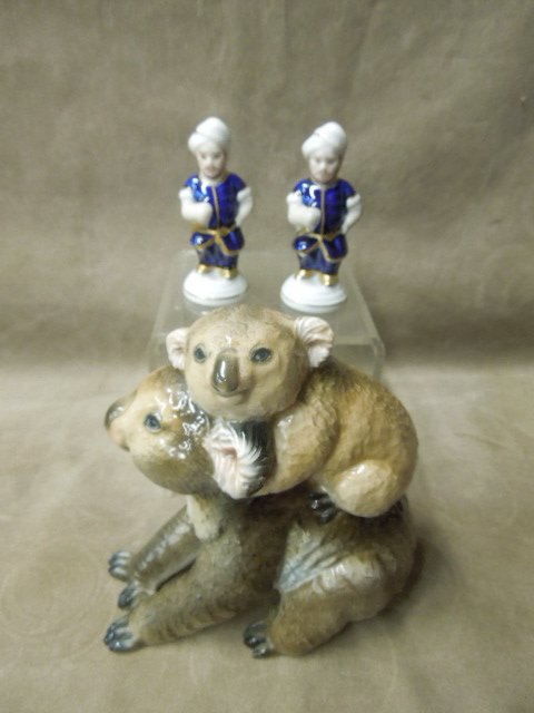 Rosenthal & Royal Dux Figure Group: Rosenthal and Royal Dux figure group, includes: Rosenthal Mamma and baby Panda, hgt 6", and pair of 3 1/4" standing figures with turbans and cobalt and gilt garb, mid 20th c. CONDITION: No issues iden