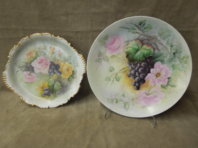 (2) Bavarian Hand Painted Chargers: (2) Bavarian Hand painted chargers, each with flowers and grapes, by Hertel Jacob Porzellan, 12" and 13 1/4", early 20th c. CONDITION: No issues noted.