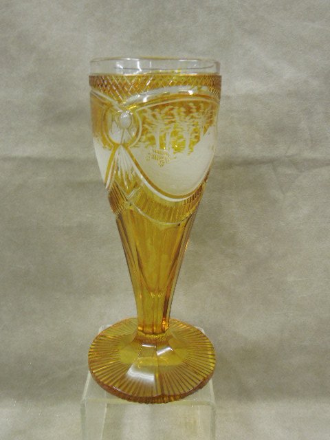 Bohemian Glass Chalice Form: Bohemian glass chalice form, amber cut to clear glass with 3 form scene landscape etched panels, late 19th c, H 9 5/8". CONDITION: No issues noted.