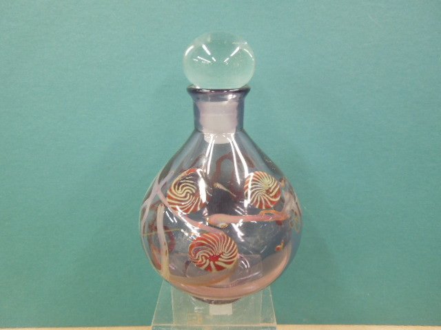Art Glass Decanter: Art glass decanter, pale amethyst glass with vines and swirled ruby glass blossoms, hand blown, illegibly signed on base, late 20th c. H 9". CONDITION: No issues identified.