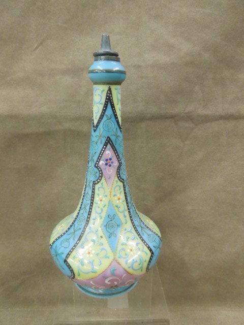 Rare Victorian Enameled Barber's Bottle: Rare Victorian enameled barber's bottle, milk glass with black beaded bordered panels of yellow blues and mauve with floral and scroll highlights, original stopper, late 19th c, hgt 9 1/4". CONDITION: