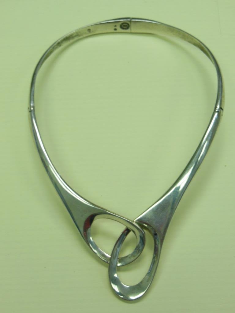Mexican Sterling Choker: Mexican sterling choker, marked "925 HECHO MEXICO," appears to be "CRR" in center. Also has eagle stamp & #10. Hinged choker with double loop design. 5 1/2" x 4 1/2" interior measurement. 3.45 ozt. [8