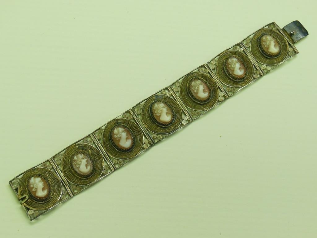 Vintage 800 Silver & Cameo Bracelet: Vintage 800 silver & cameo bracelet, 7 filigree gold washed 1" sq lings supporting 7 female cameo profiles. 800 * hallmark stamped on "v" spring clasp, 1.2 ozt. 7 1/2" length. [86] CONDITION: Very goo
