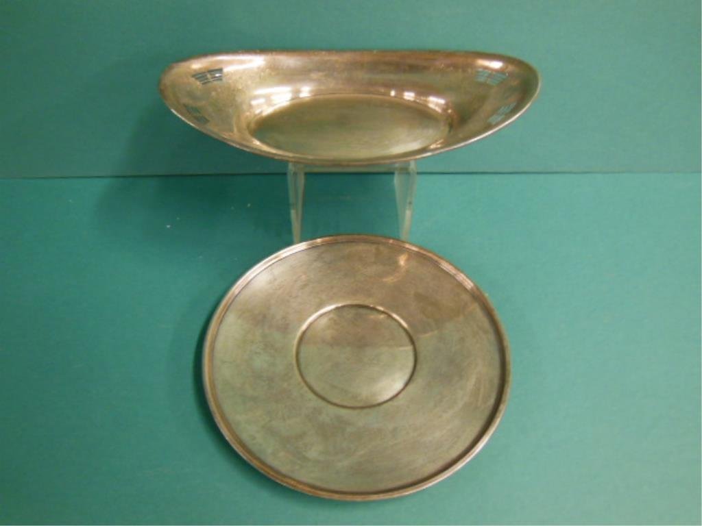 2 Sterling Silver Tableware Pieces: 2 Sterling silver tableware pieces, includes: Whiting Co. Bread bowl with floral wreath chaising & reticulation (L12"), and a 9 1/2"D rimed plate by Manchester Silver Co, mid 20th c. 14.35 ozts TW. CO