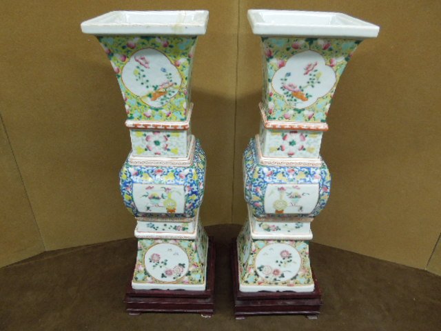 Pair Famille Rose Beaker Form Vases: Pair Famille Rose Beaker form vases; Chinese porcelain, the top and base with verte field, the center with blue fields; all with panels of birds & flowers fitted rosewood bases; 19th c, hgt 15 1/4". C